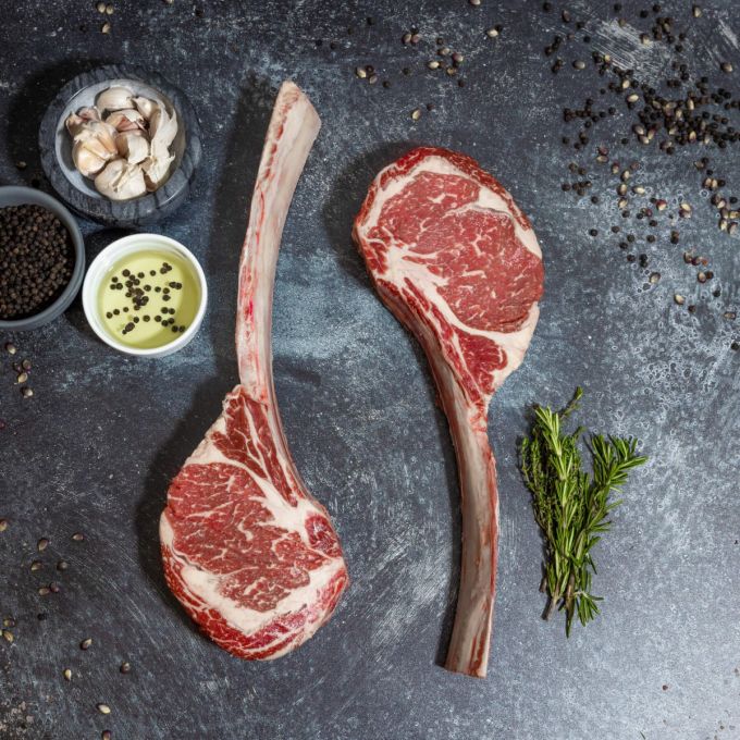High-quality Reserve Tomahawk Steak with long bone-in ribeye, marbled texture, and wet-aged finish.