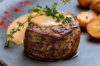 Close-up of Wagyu filet mignon showing center-cut precision and buttery texture.